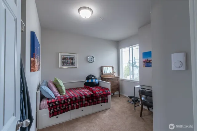 a bedroom with bed and a window