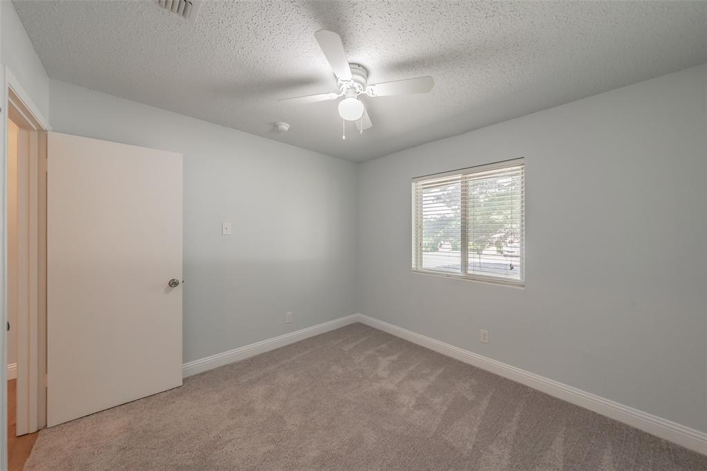 1301 Cedar Ridge Terrace Euless, TX 76039 - Photo 25 of 31 Secondary bedrooms feature carpet and ceiling fans. Two inch blinds throughout the house.