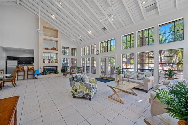 a swimming pool with outdoor seating and yard
