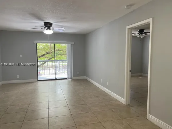a view of an empty room with a window