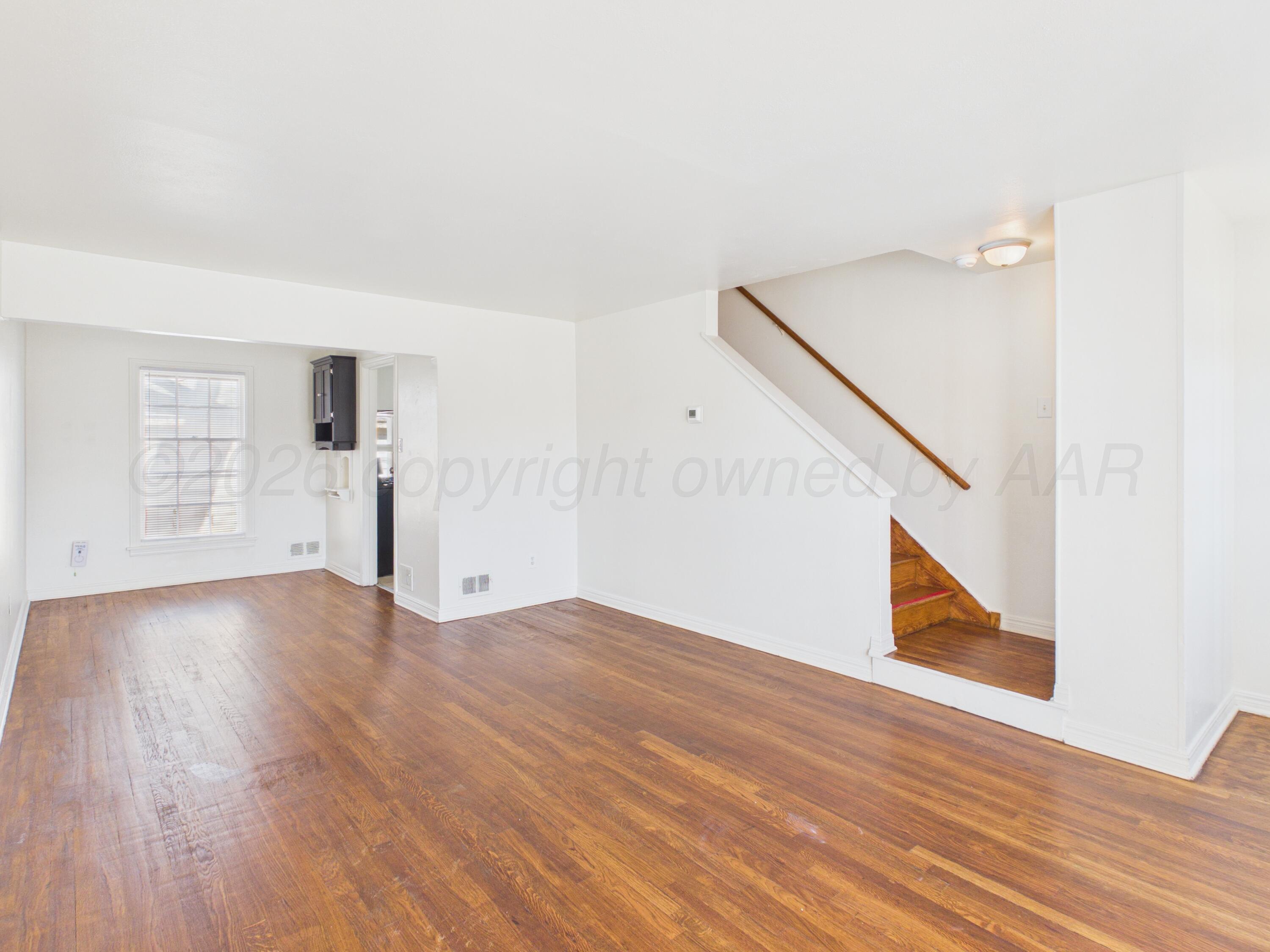 412 Southwest 17th Avenue Amarillo, TX 79102 - Photo 6 of 22 a view of empty room with wooden floor and fan