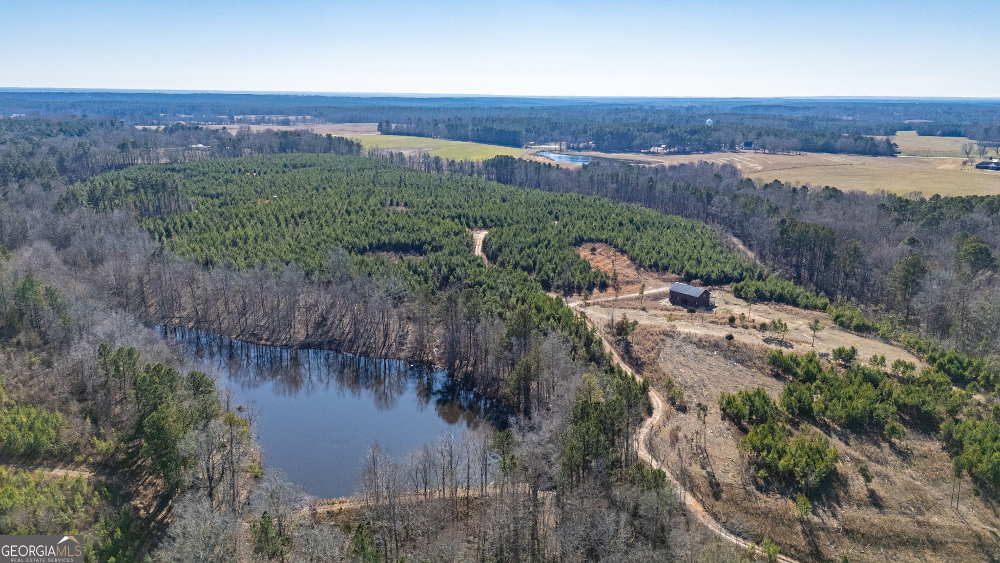 an aerial view of valley and lake