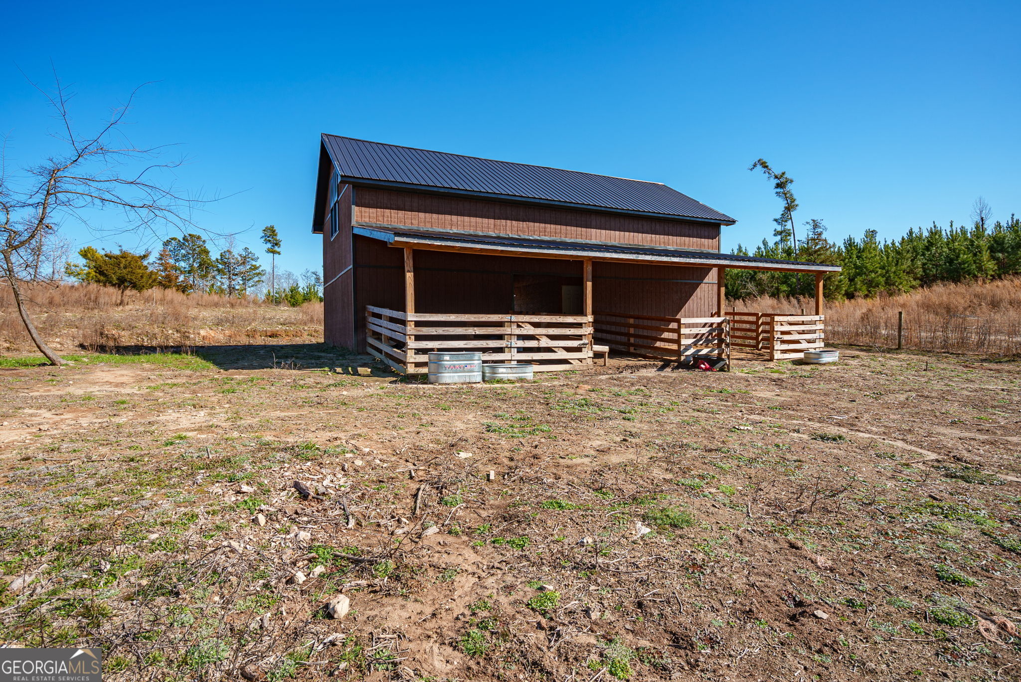 0 Warren Road White Plains, GA 30678 - Photo 24 of 37 a backyard of a house with table and chairs