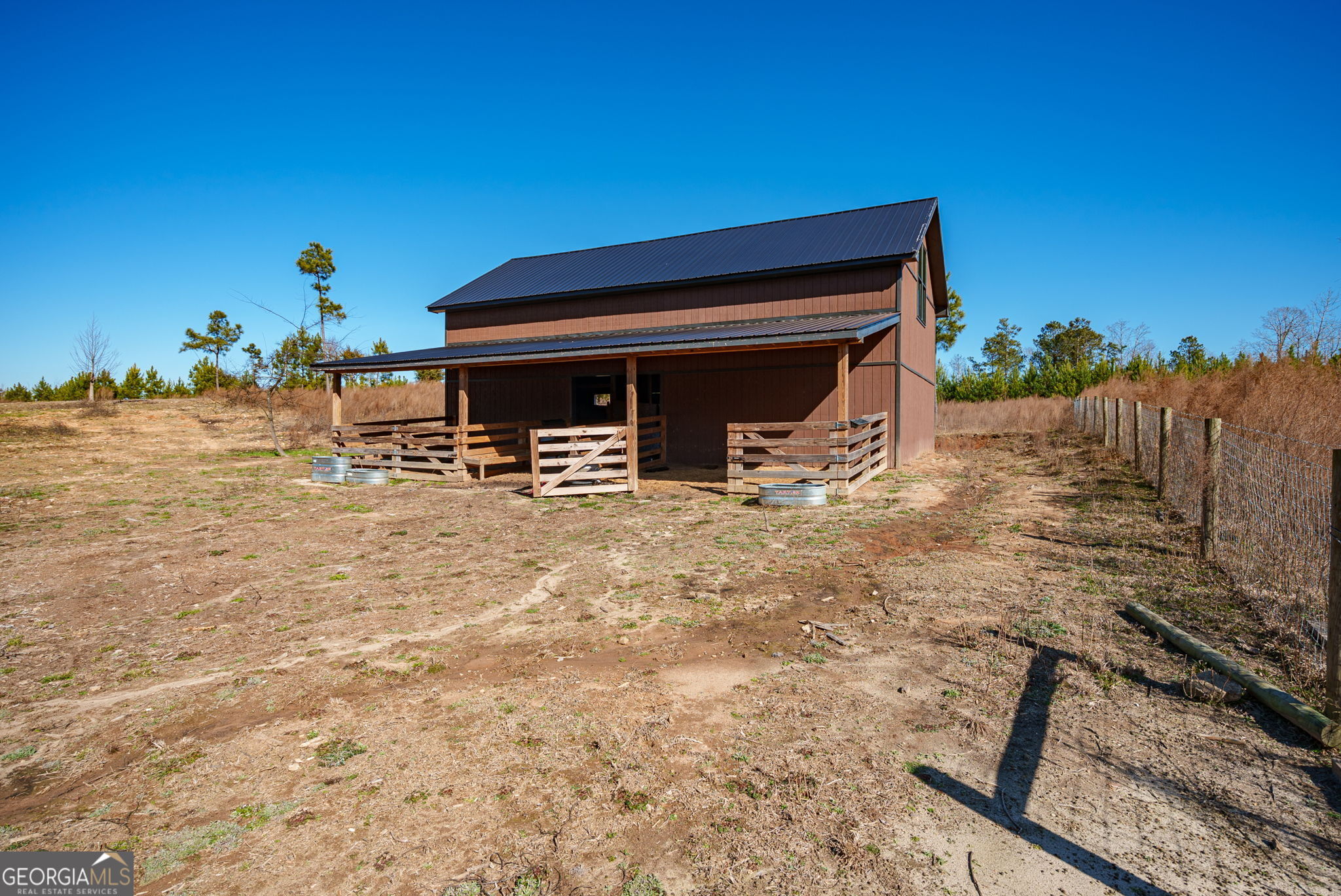0 Warren Road White Plains, GA 30678 - Photo 31 of 37 a backyard of a house with table and chairs