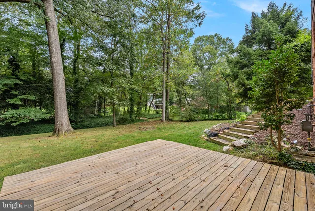 a view of a wooden deck and garden