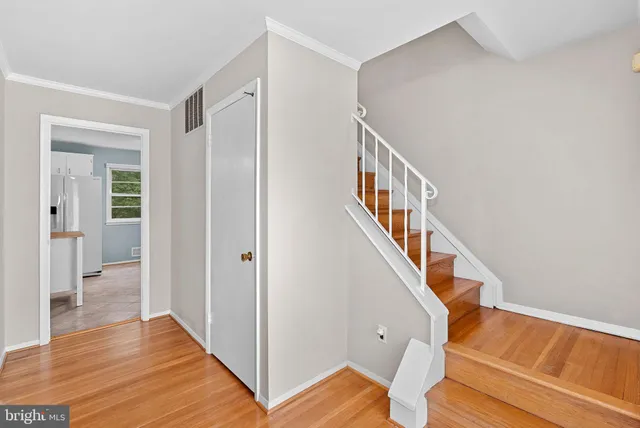 a view of an entryway with wooden floor