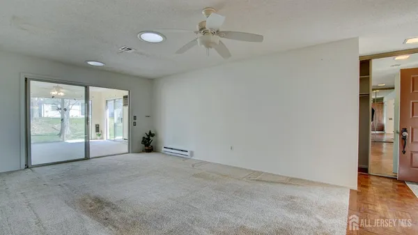 a view of an empty room with a window