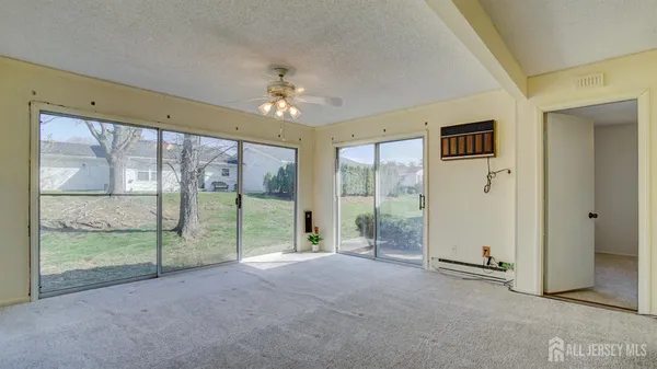 a view of an empty room with windows