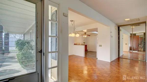 a view of a glass door and a living room