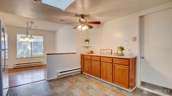 a kitchen with stainless steel appliances granite countertop a refrigerator a sink and dishwasher