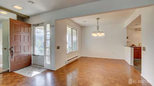 a view of an empty room with glass door