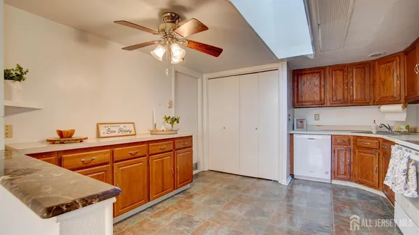 a kitchen with stainless steel appliances granite countertop a sink and cabinets