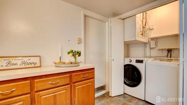 a view of a hallway with washer and dryer