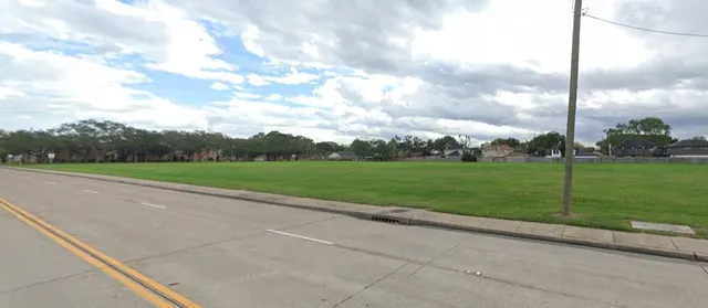 a view of a golf course with a garden