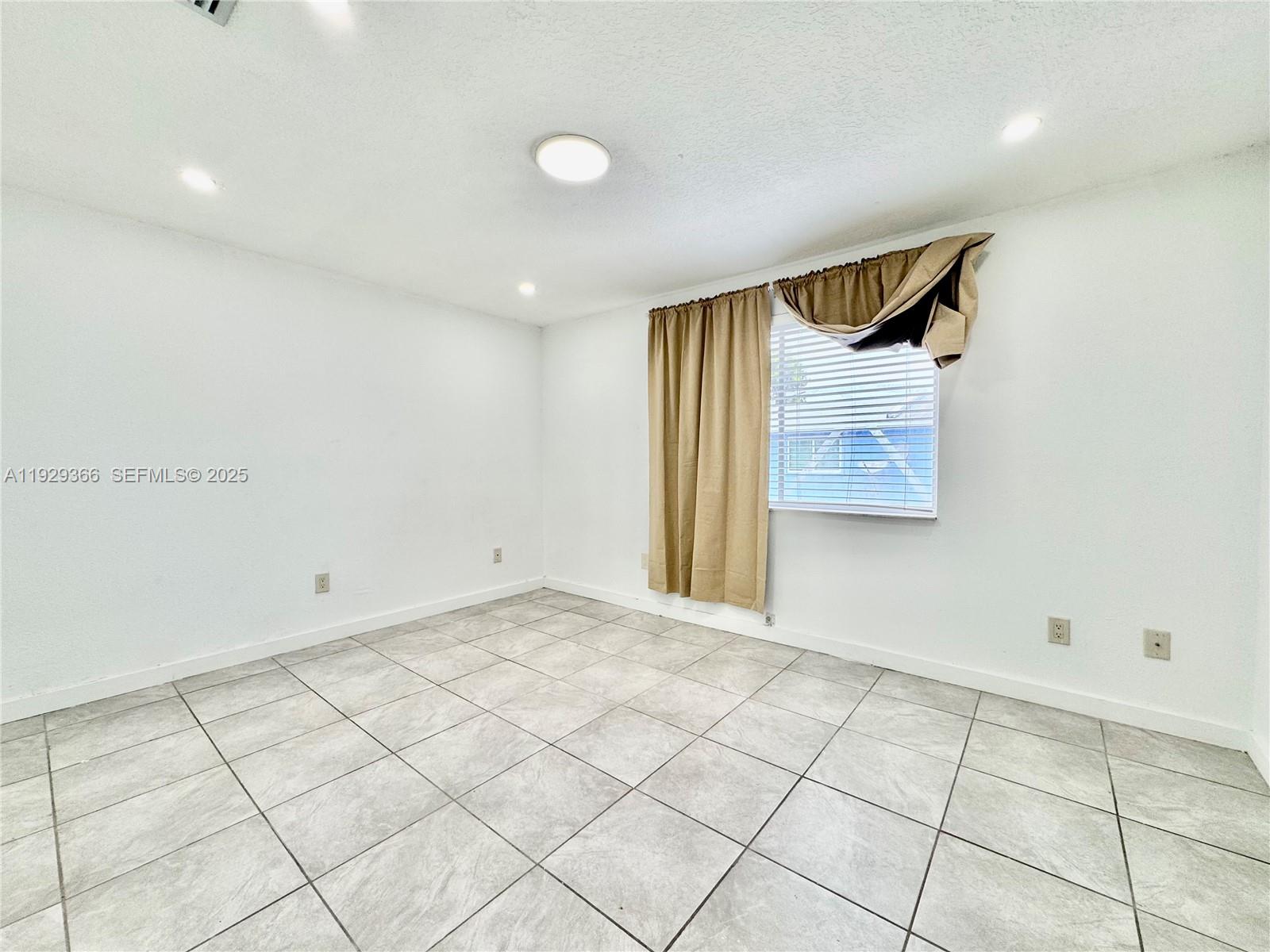 22205 Southwest 103rd Avenue, Unit 22205 Cutler Bay, FL 33190 - Photo 11 of 16 a view of an empty room