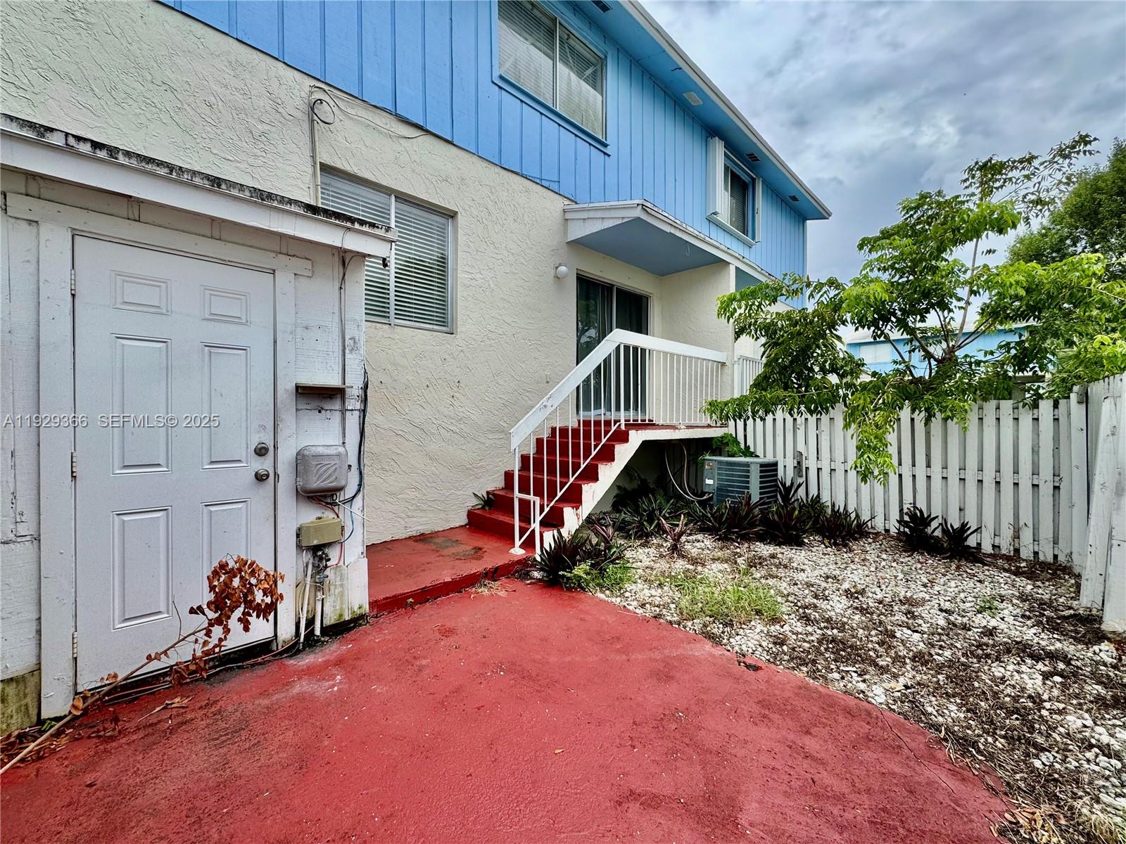 22205 Southwest 103rd Avenue, Unit 22205 Cutler Bay, FL 33190 - Photo 6 of 16 a view of a chair and table in the house