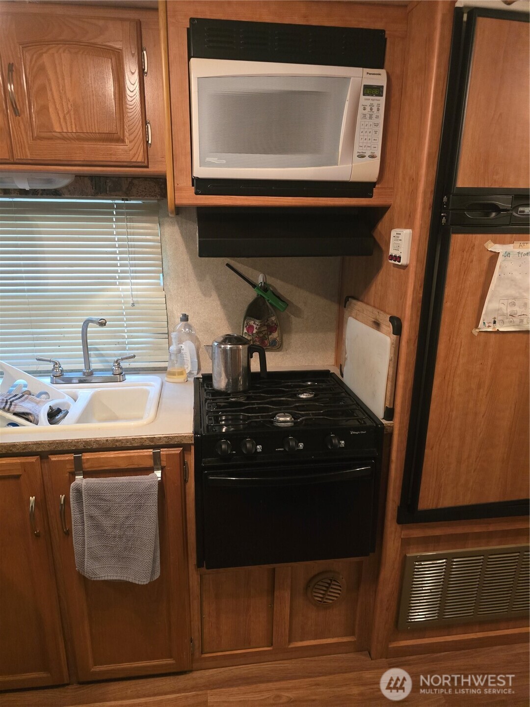 35-2 Wilderness Way Maple Falls, WA 98266 - Photo 13 of 22 a kitchen with a stove and a microwave