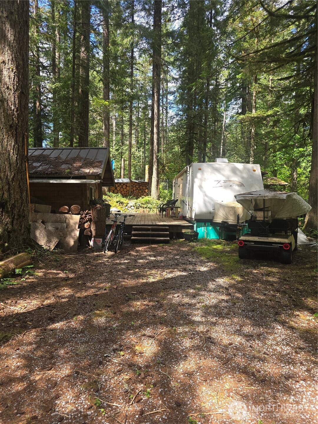 35-2 Wilderness Way Maple Falls, WA 98266 - Photo 3 of 22 a view of a yard with car parked