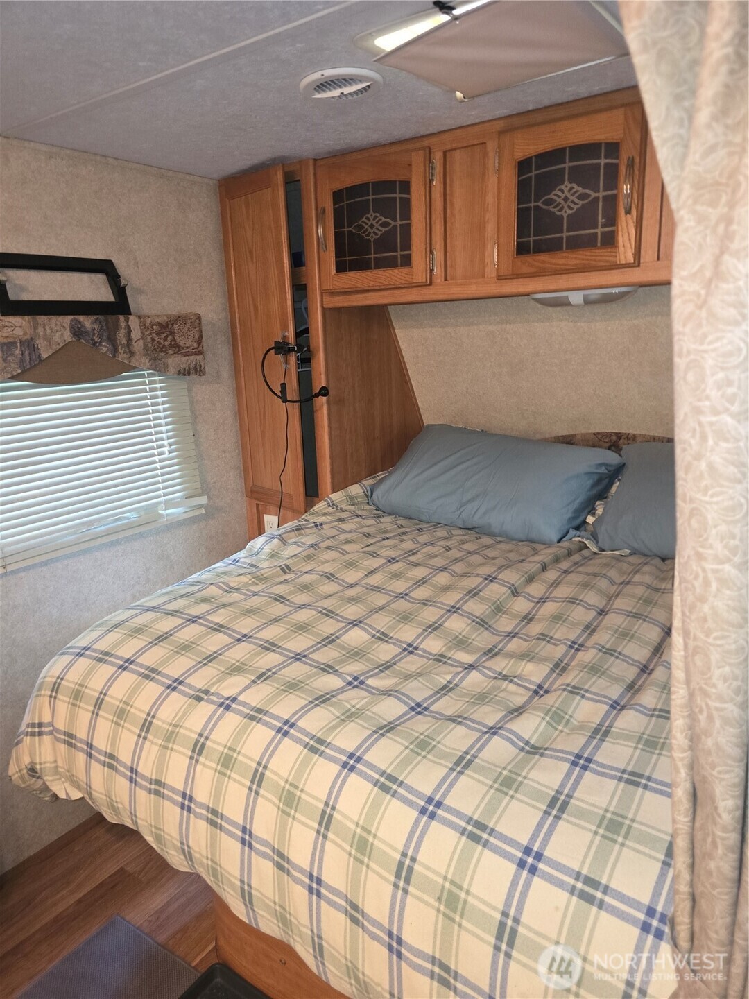 35-2 Wilderness Way Maple Falls, WA 98266 - Photo 4 of 22 a bedroom with a bed and wooden floor