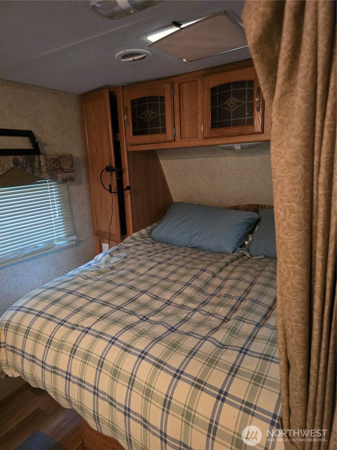 35-2 Wilderness Way Maple Falls, WA 98266 - Photo 5 of 22 a bedroom with a bed and a flat tv screen