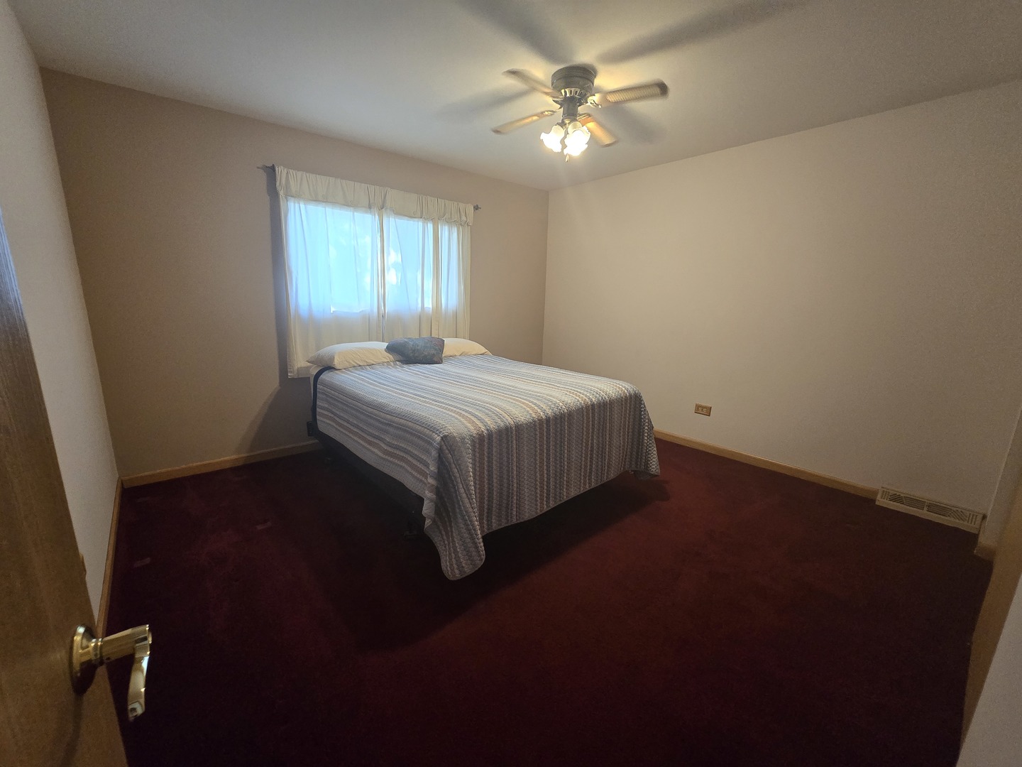 14431 Tripp Avenue Midlothian, IL 60445 - Photo 11 of 14 a bedroom with a bed and a window