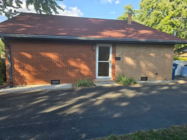 a view of a house with a street