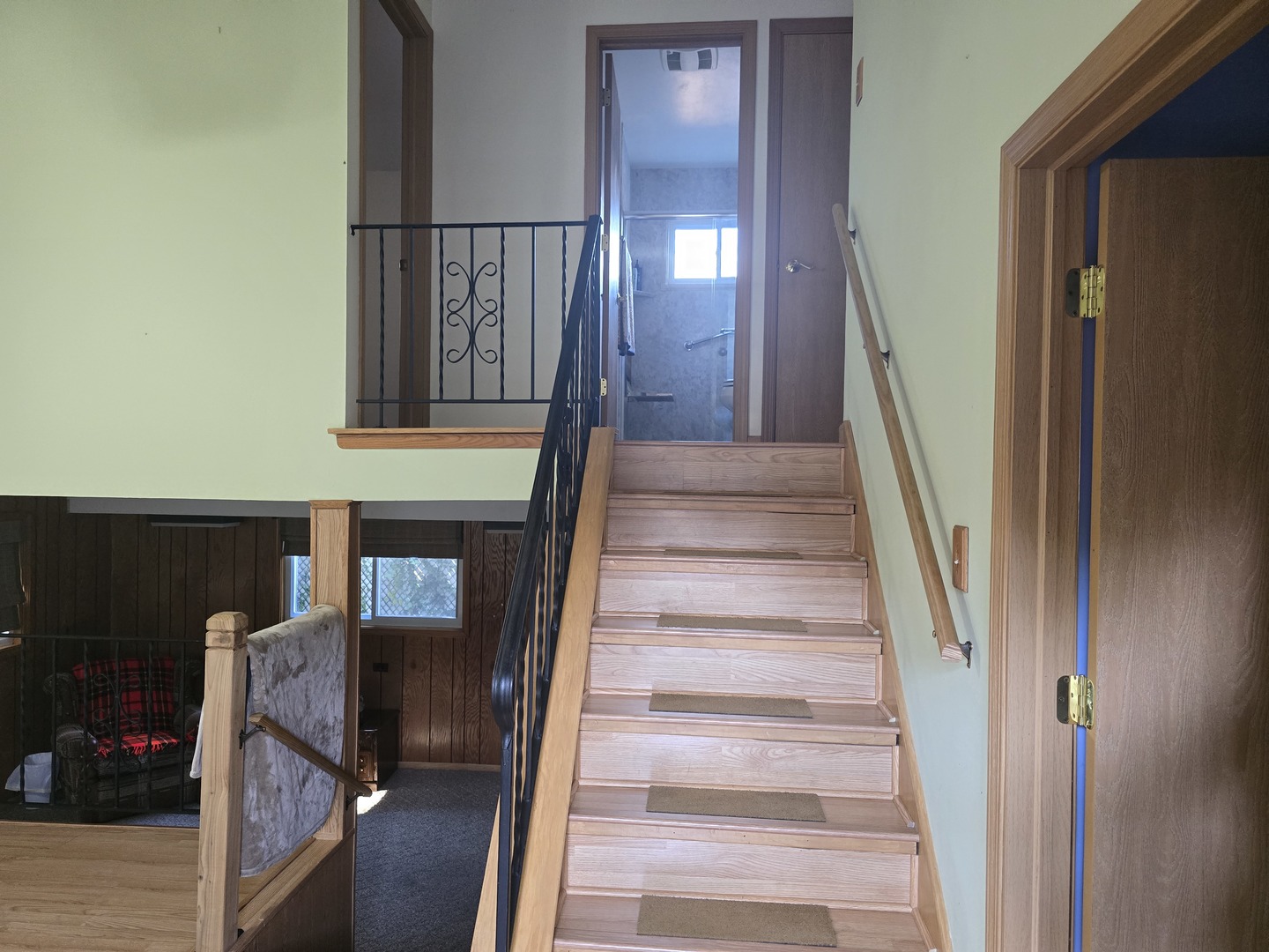 14431 Tripp Avenue Midlothian, IL 60445 - Photo 4 of 14 a view of staircase with lots of frames on wall and a window