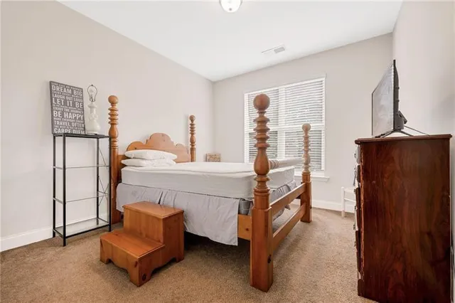 a bedroom with furniture and a window