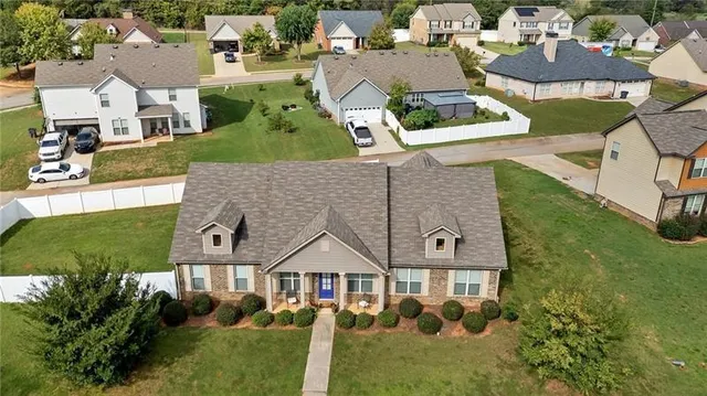 an aerial view of a house with a garden