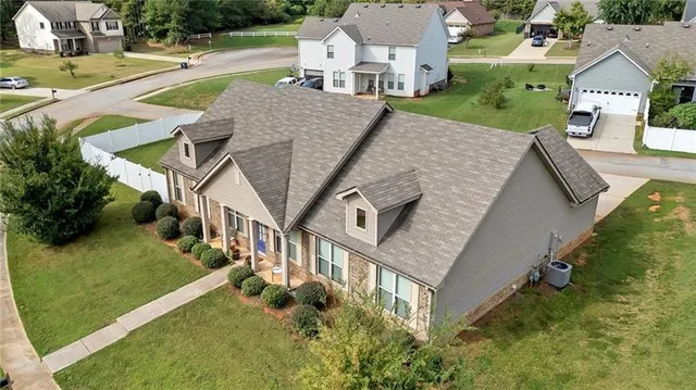 an aerial view of a house with porch