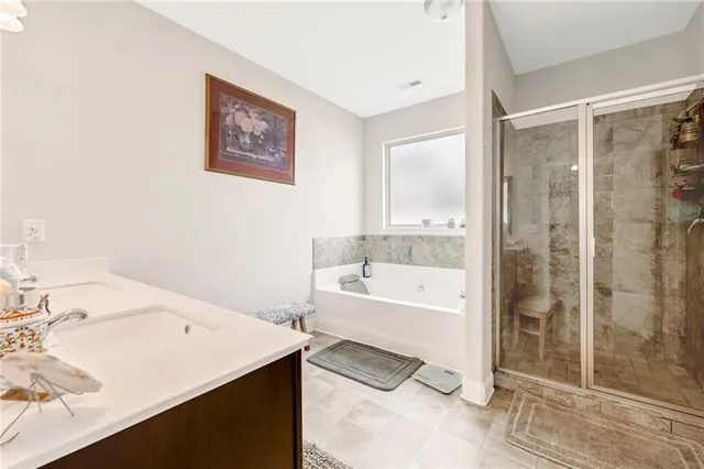 a bathroom with a bathtub and a sink