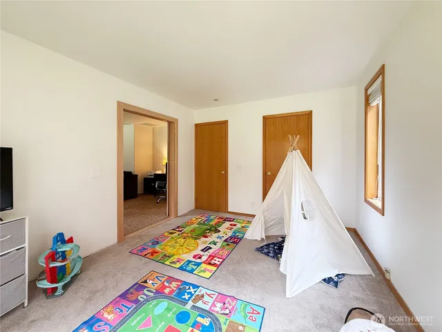 a view of a house with a yard and sitting area