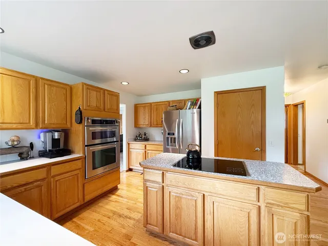 a bedroom with bed and window