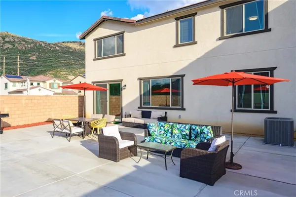 a view of a house with pool and a yard