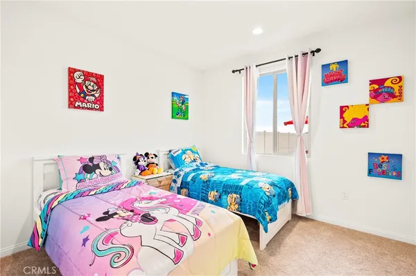 a bedroom with bed and a window