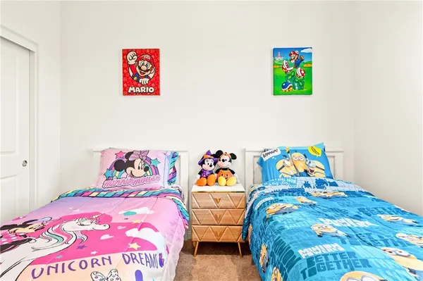 a bedroom with a bed and a lamp