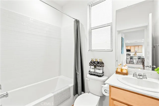 a bedroom with a bed and dresser