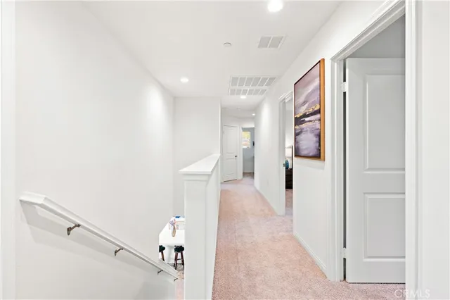 a view of a hallway with front door