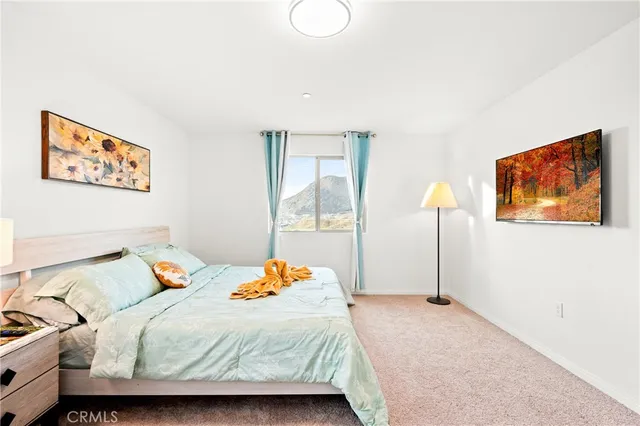 a white toilet and tub sitting next to a window