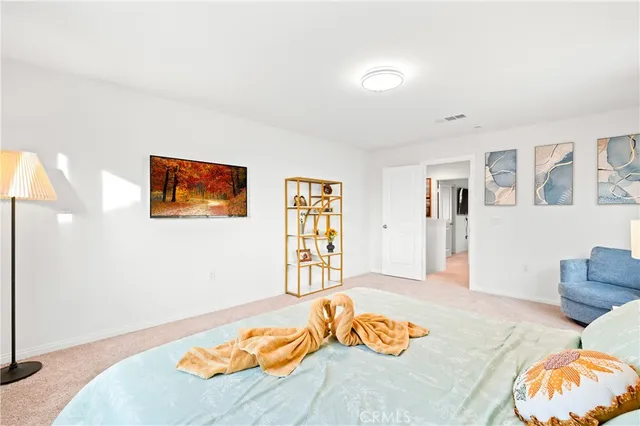 a bedroom with a bed and dresser