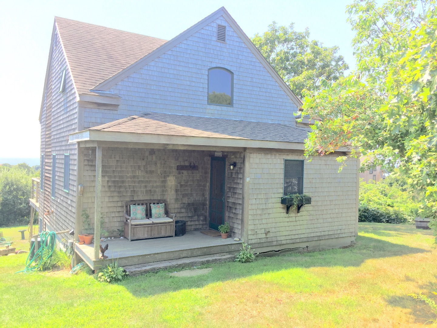 4 Raymonds Way Aquinnah, MA 02535 - Photo 19 of 20 a front view of a house with a yard
