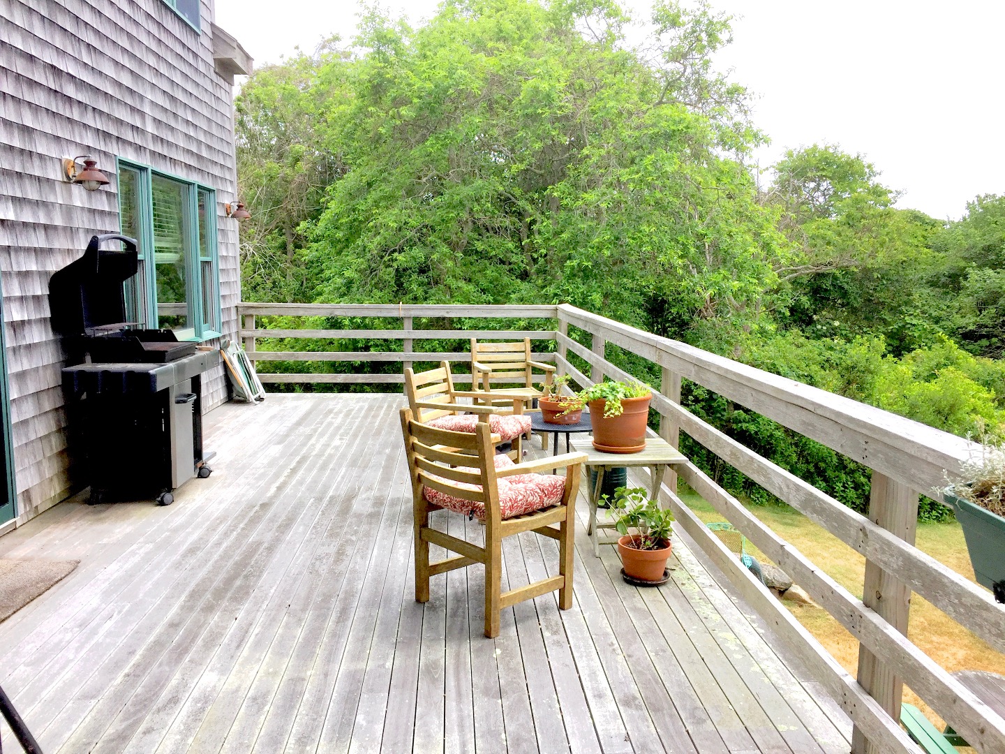 4 Raymonds Way Aquinnah, MA 02535 - Photo 10 of 20 a view of a chairs and table on the wooden deck