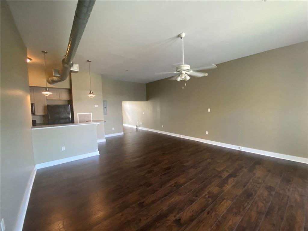 502 Pryor Street Southwest, Unit 322 Atlanta, GA 30312 - Photo 6 of 8 wooden floor in an empty room with a window