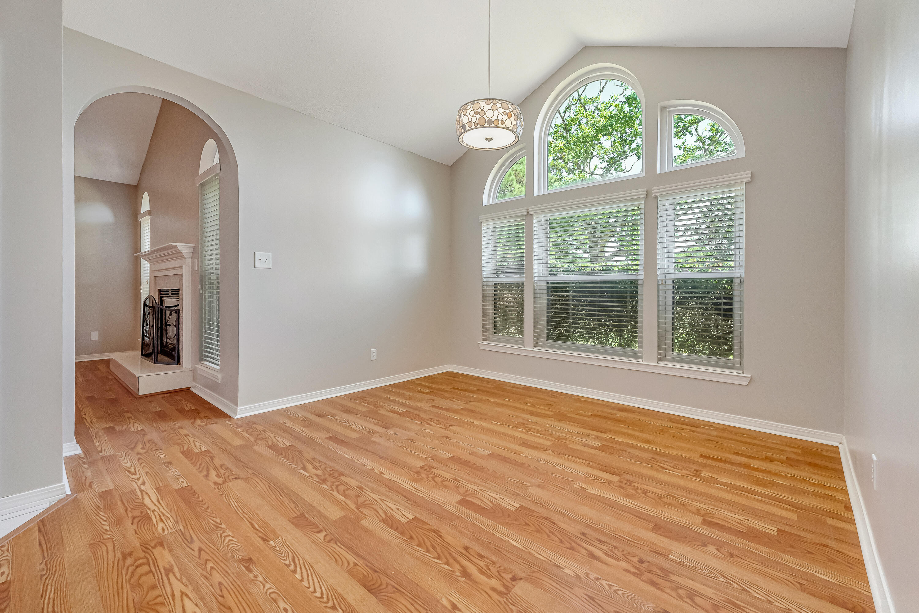 901 Shalimar Cove Shalimar, FL 32579 - Photo 12 of 63 an empty room with wooden floor windows and outdoor space