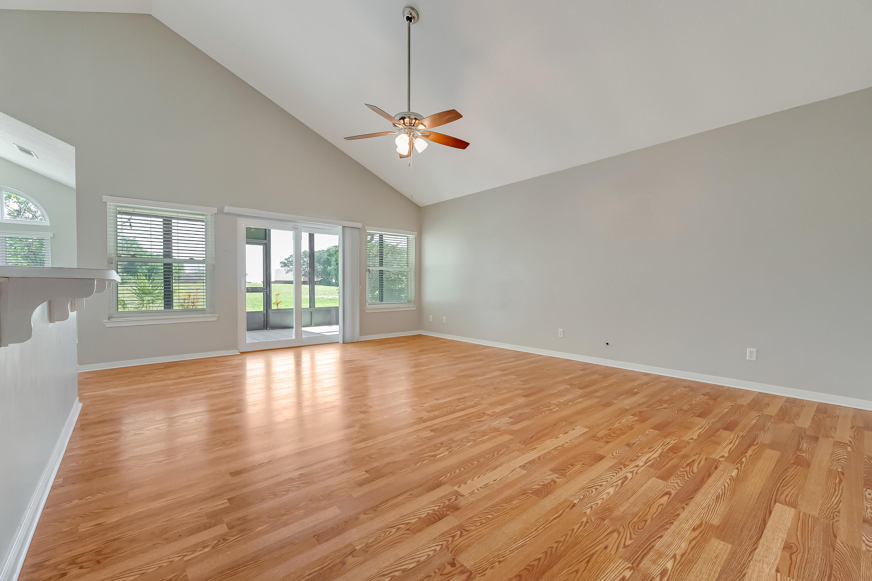 901 Shalimar Cove Shalimar, FL 32579 - Photo 26 of 63 a view of an empty room with wooden floor and a window