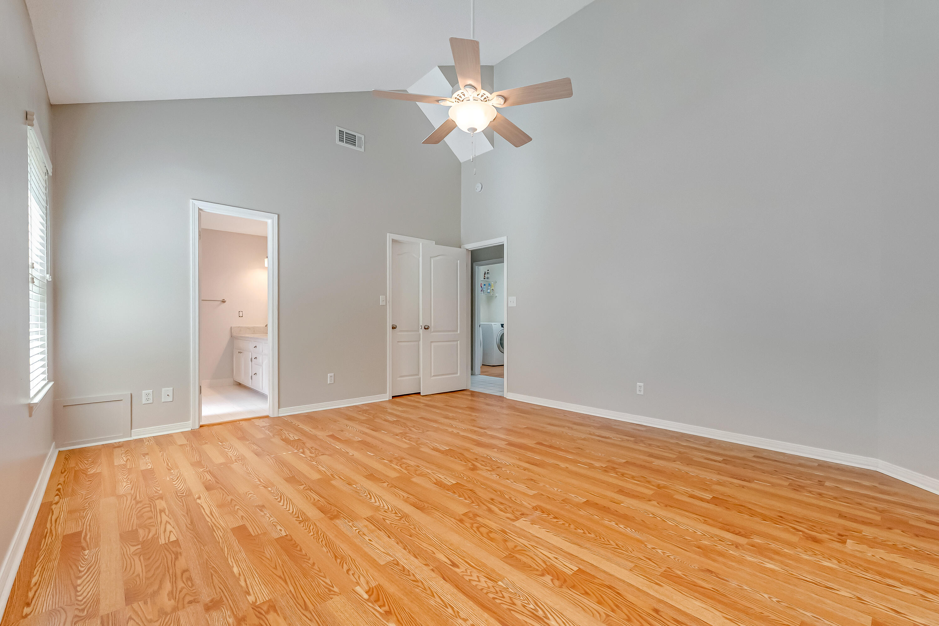 901 Shalimar Cove Shalimar, FL 32579 - Photo 33 of 63 a view of a room with a ceiling fan and wooden floor