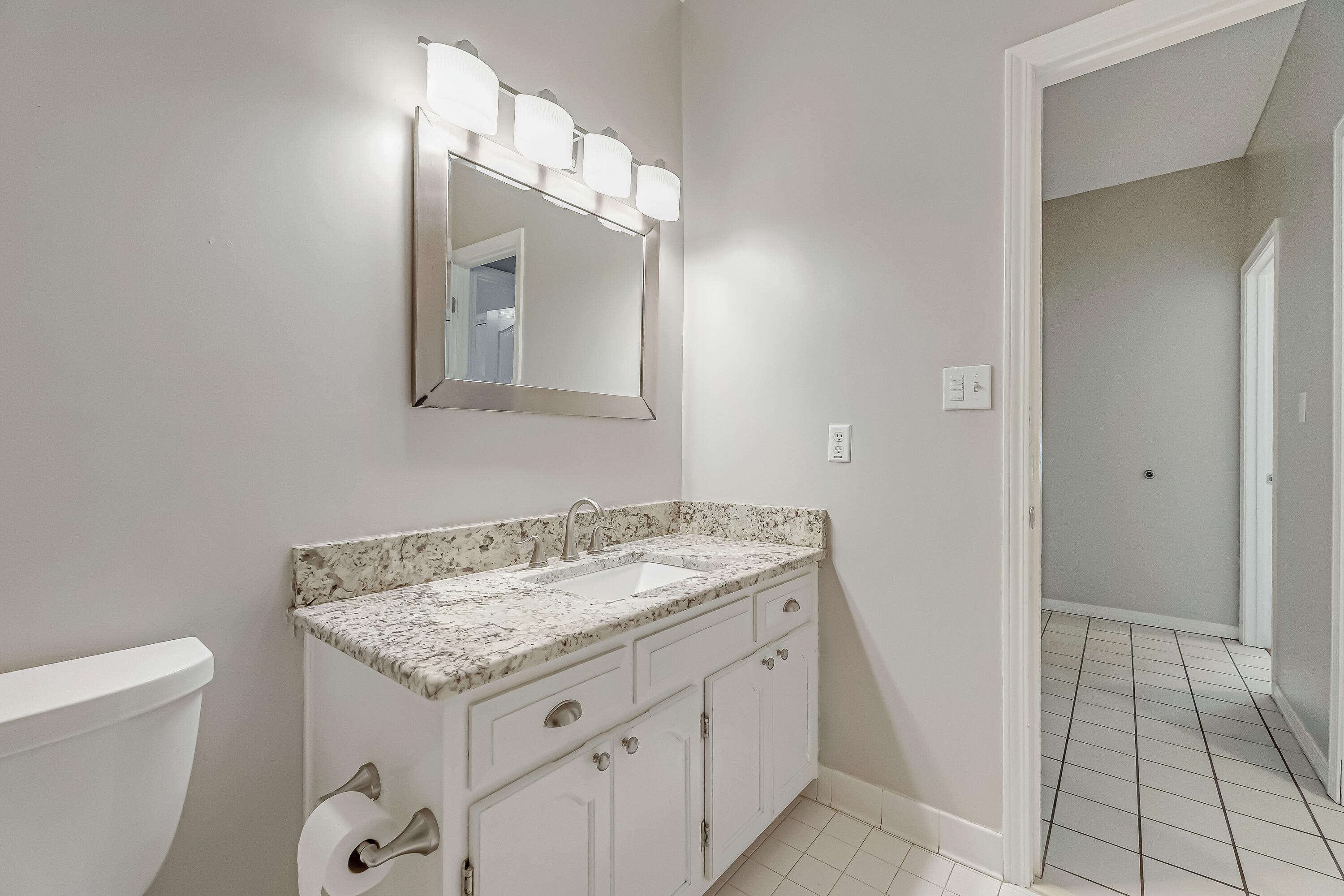 901 Shalimar Cove Shalimar, FL 32579 - Photo 46 of 63 a bathroom with a granite countertop sink and a mirror