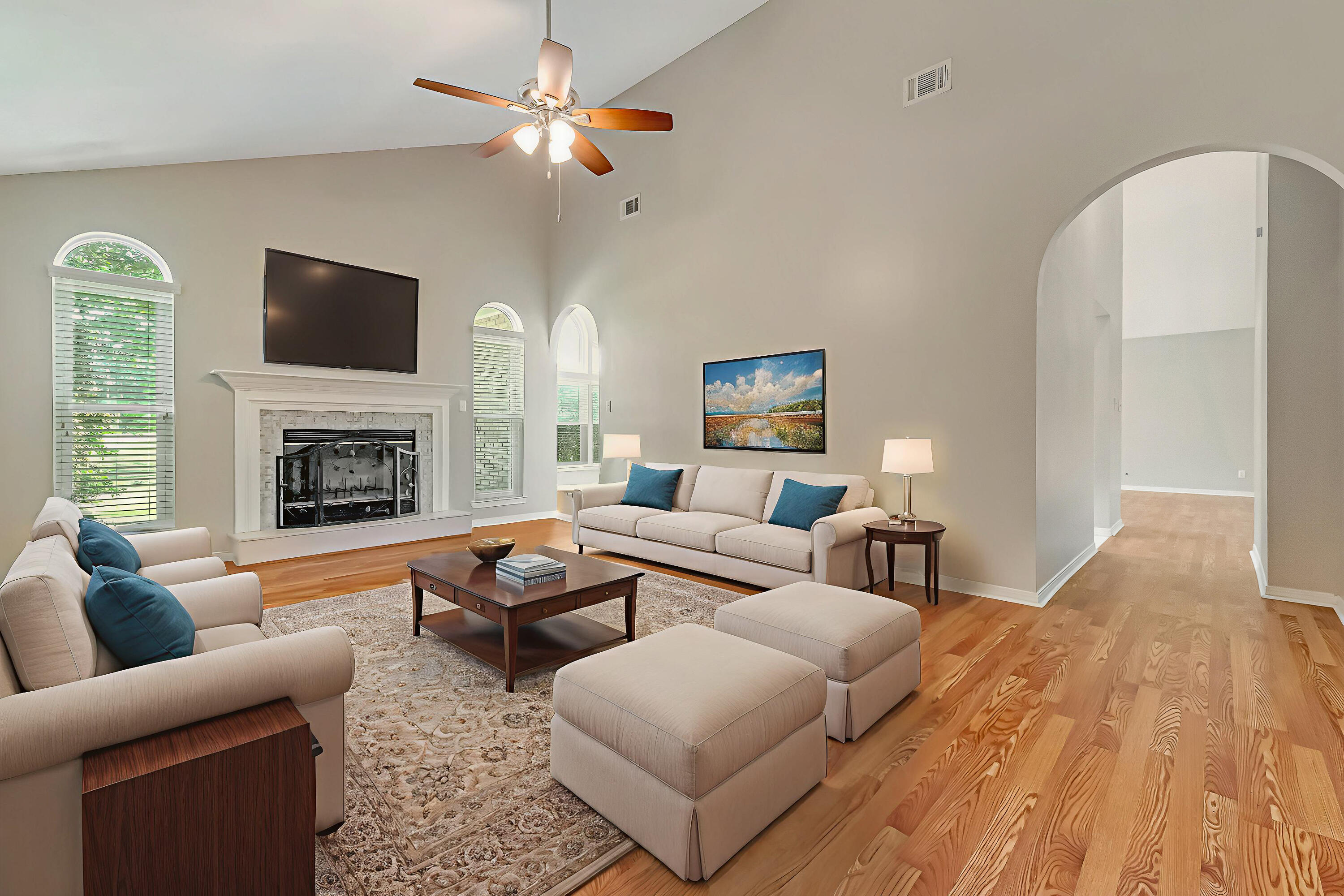 901 Shalimar Cove Shalimar, FL 32579 - Photo 5 of 63 a living room with furniture a flat screen tv and a fireplace