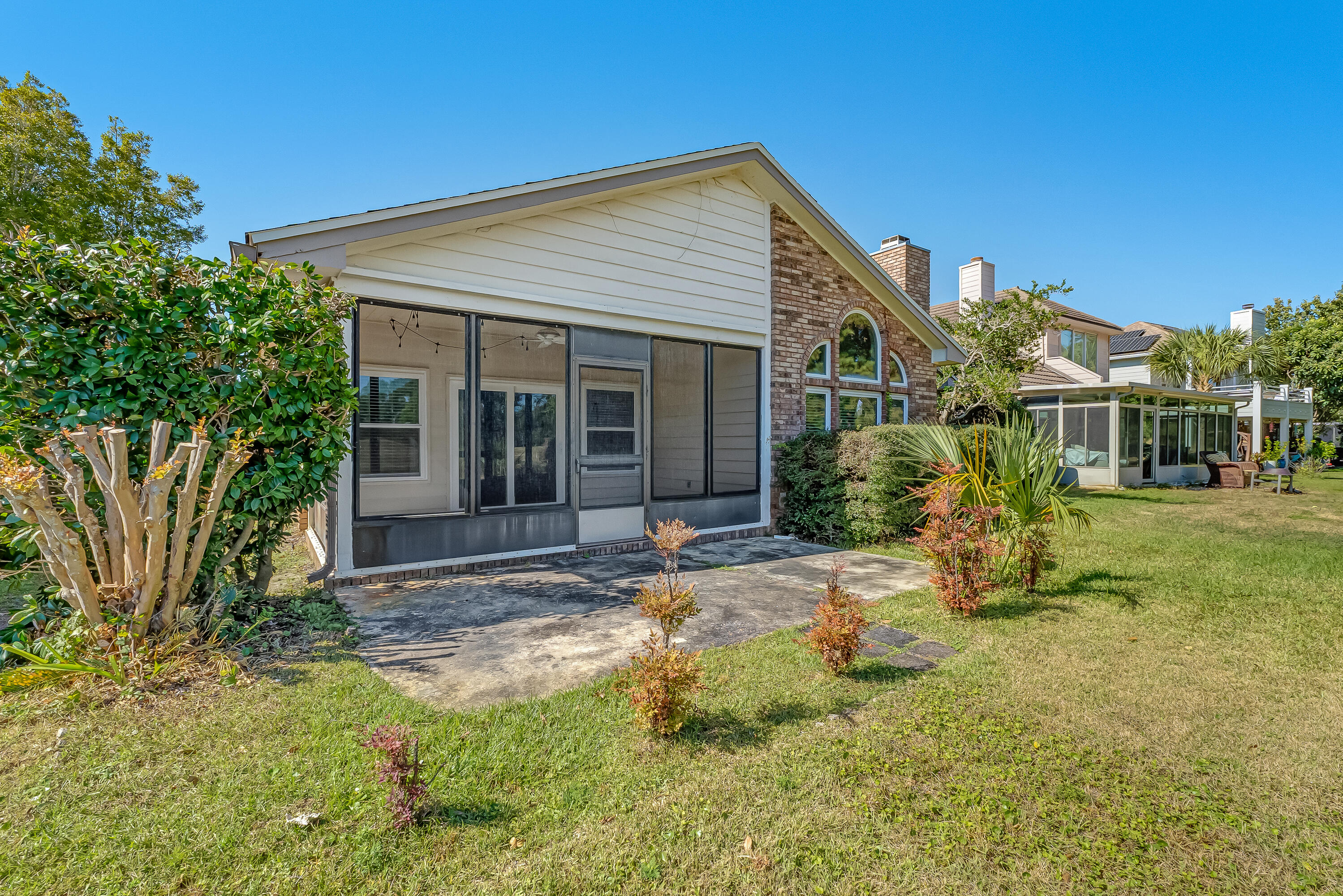 901 Shalimar Cove Shalimar, FL 32579 - Photo 56 of 63 a view of a house with backyard and garden