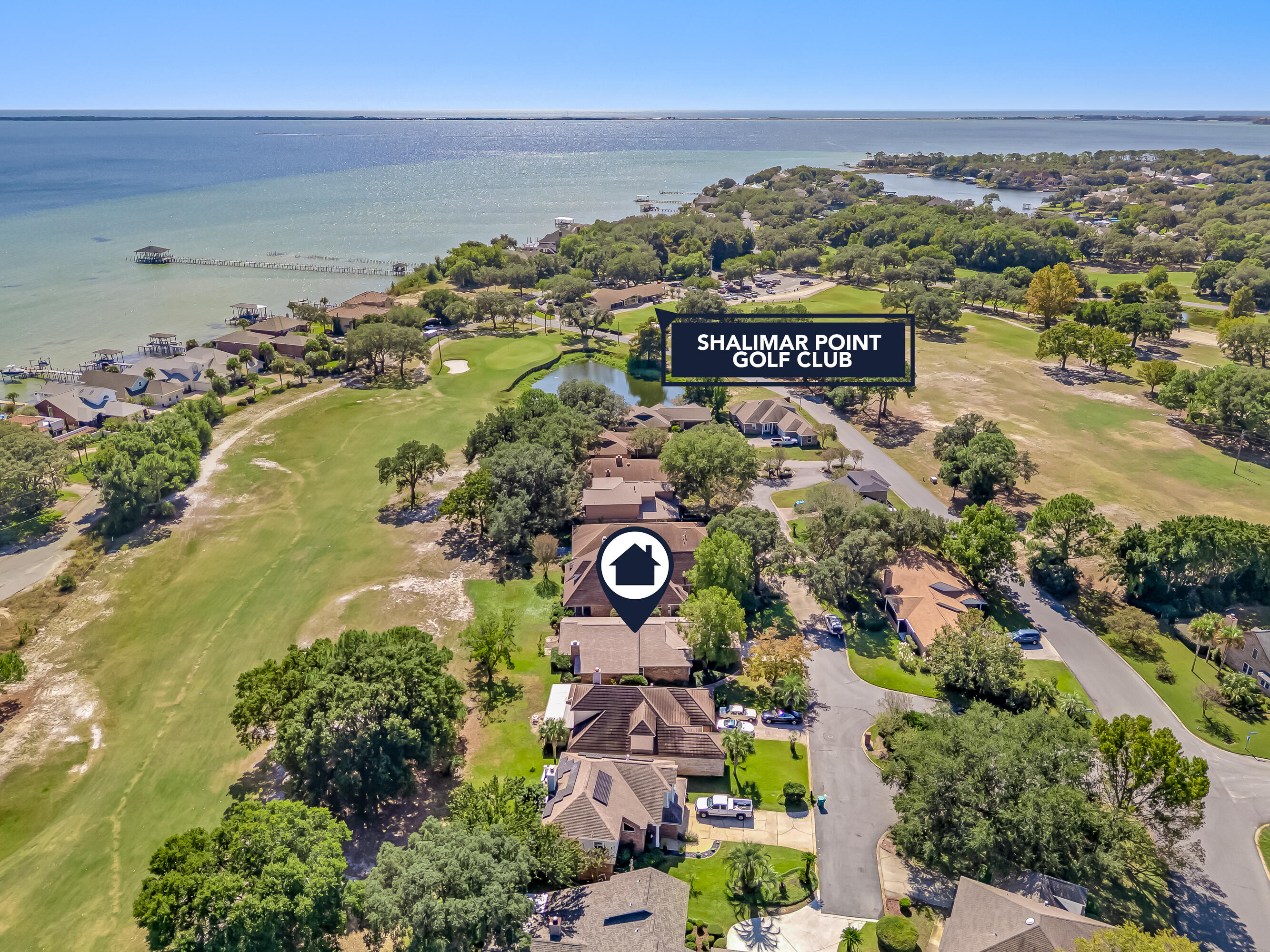 901 Shalimar Cove Shalimar, FL 32579 - Photo 62 of 63 an aerial view of a residential building ocean and trees in the background